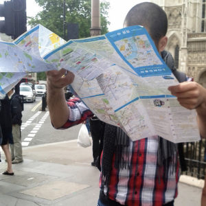 lost tourist examines a map