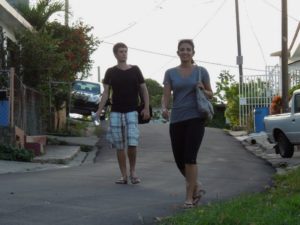 Jackie and Caleb walk along a Vieques street