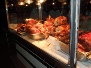 Roast meat under heat lamps