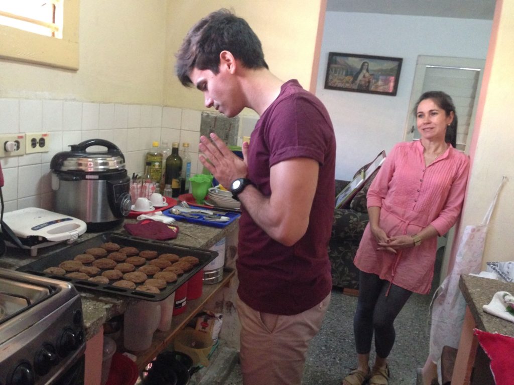 Adolfo waits impatiently for our beautiful cookies to cool as his mom fondly looks on