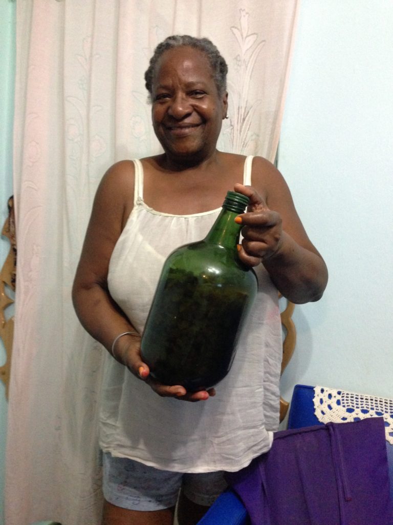 Cuban woman with a jug of liquor