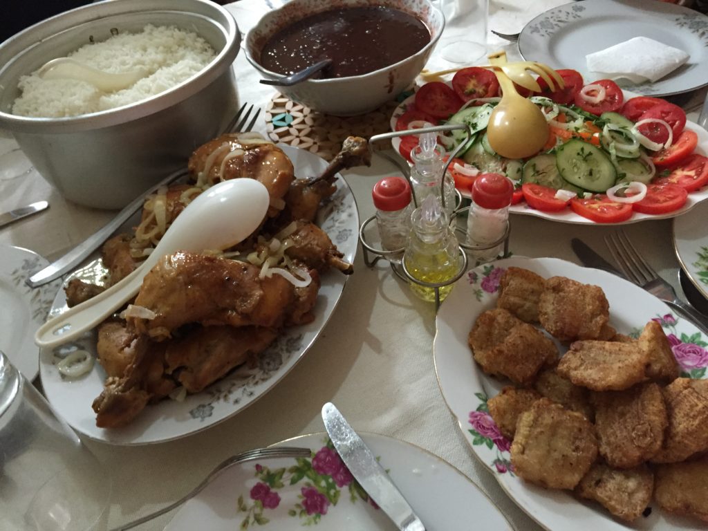 Here's an example of Cuban home cooking. Classic meal elements are a meat, rice and beans, salad, and some kind of fried root vegetable. In this case, the beans are black, and the root vegetable is fried green plantains, aka tostones.