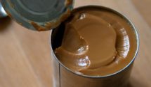 a can of freshly made dulce de leche