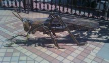 metal sculpture of a grasshopper