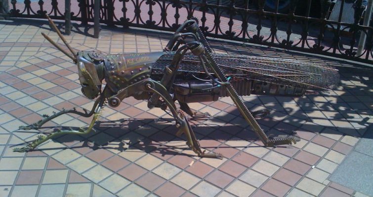 metal sculpture of a grasshopper