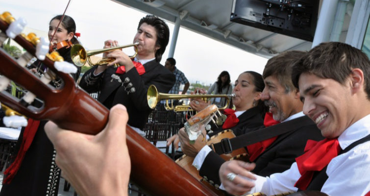 a mariachi band plays