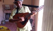 Older man playing a lute