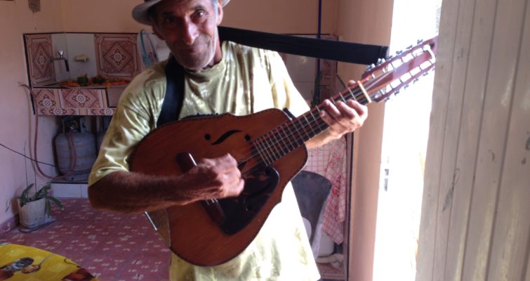 Older man playing a lute