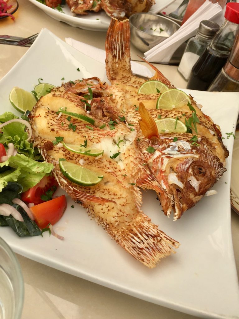 A plate of whole fried fish