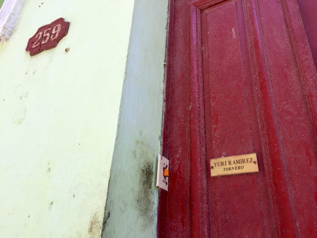 Door with a small sign reading Yuri Ramirez - Tornero